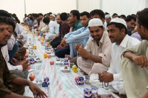 muslim men breaking their fast during ramadan