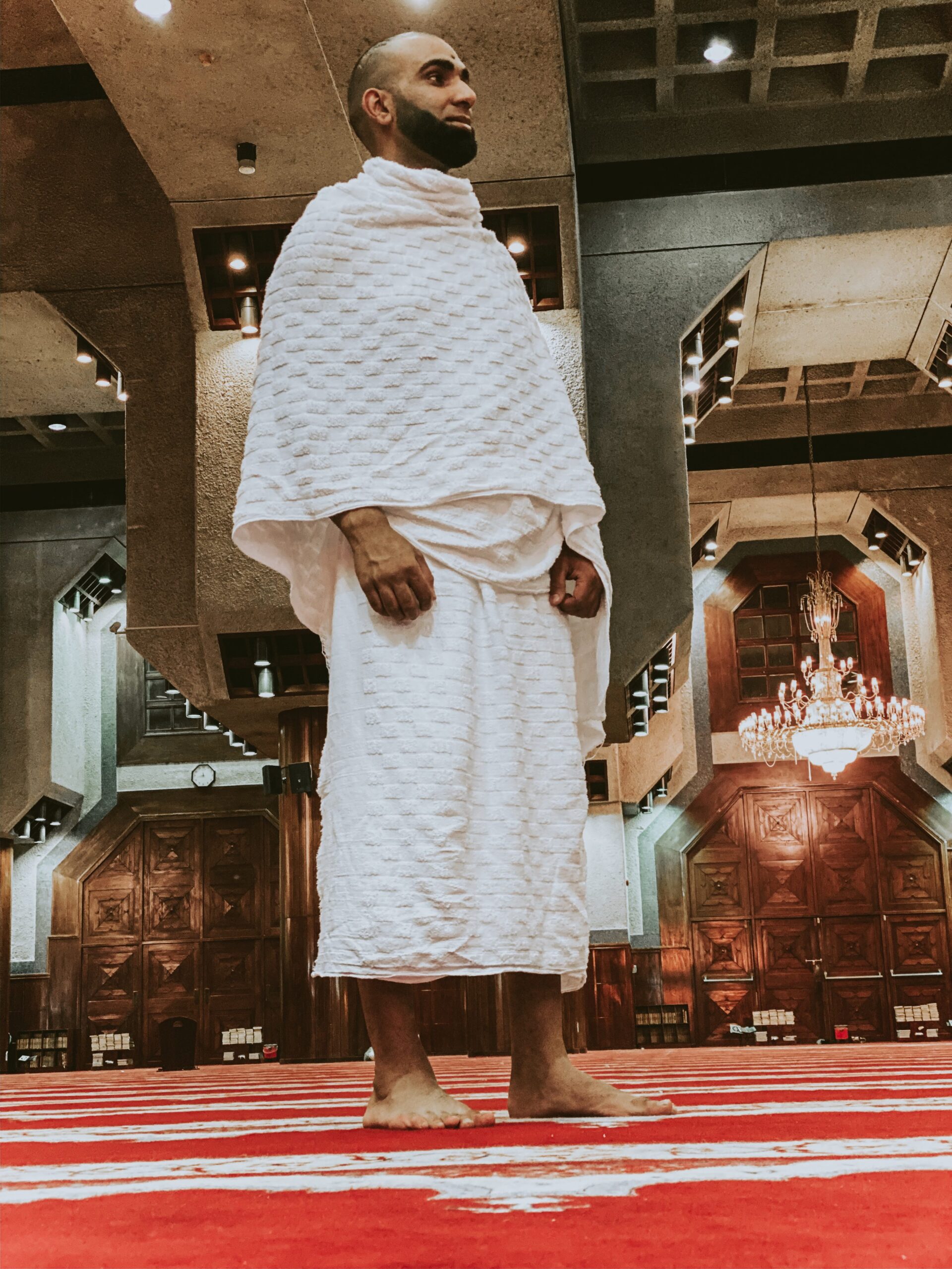 Muslim man praying at a mosque in saudi arabia