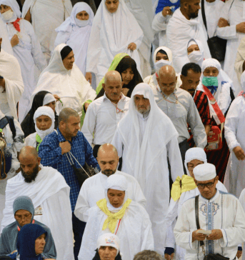muslim men and women following the rules of ihram