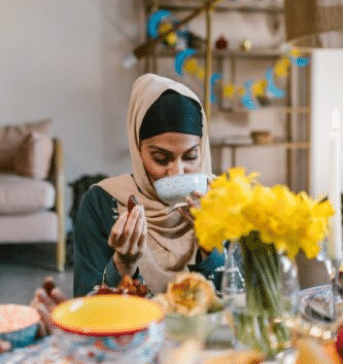 muslim women feeding her muslim friends during ramadan