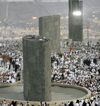 muslims throw pebbles at the jamarat during hajj