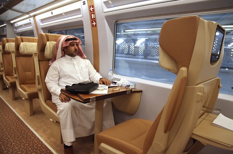 Saudi passenger on a train to Mecca