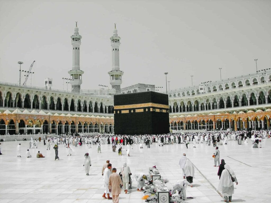 muslims engaged in umrah badal performing tawaf around kaaba