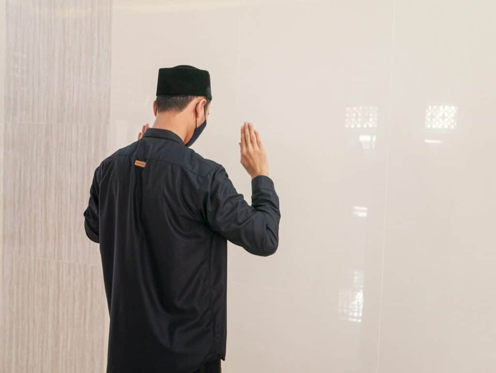 muslim man praying inside masjid jirranah
